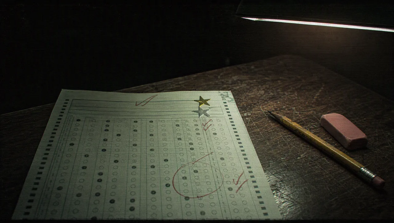 A graded answer sheet with a gold star and a silver star sticker, a pencil and an eraser beside it