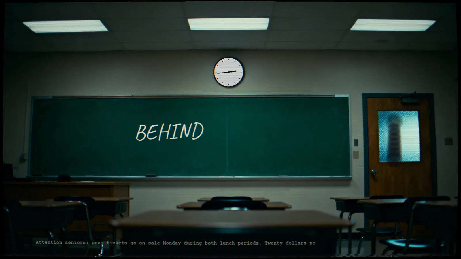 The chalkboard reads BEHIND